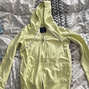 cute neon yellow zip up. worn but still in great condition.
